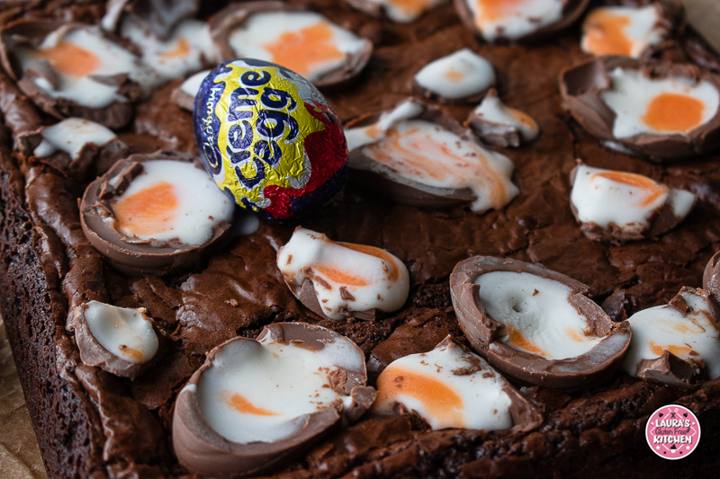 Slice of fudgy gluten-free brownie with melted creme egg centre