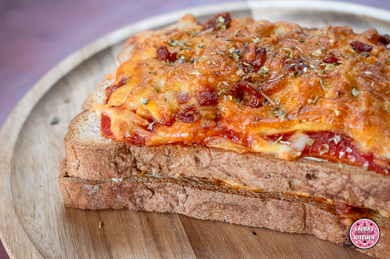 Gluten-free pizza toastie topped with melted cheese and chorizo cooked in the air fryer.