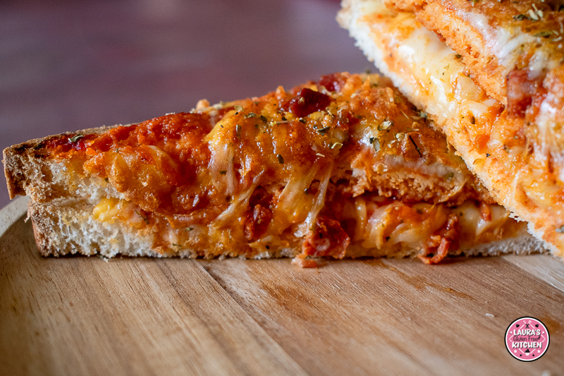 Gluten-free pizza toastie topped with melted cheese and chorizo cooked in the air fryer.