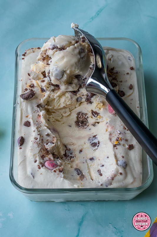Scoops of mini egg ice cream with crushed Cadbury Mini Eggs in a bowl.